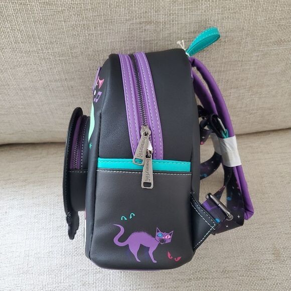 haunted mansion mini backpack Loungefly The Leotas face is framed within her crystal ball on the front of this mini backpack by Loungefly that features glow Disney Parks Loungefly Backpack Haunted